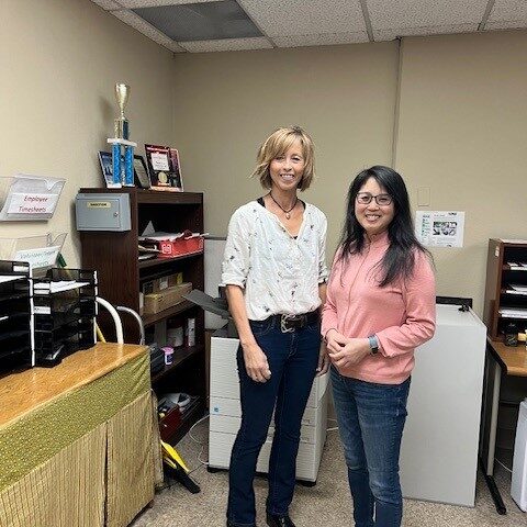 Photo of 2 women in office