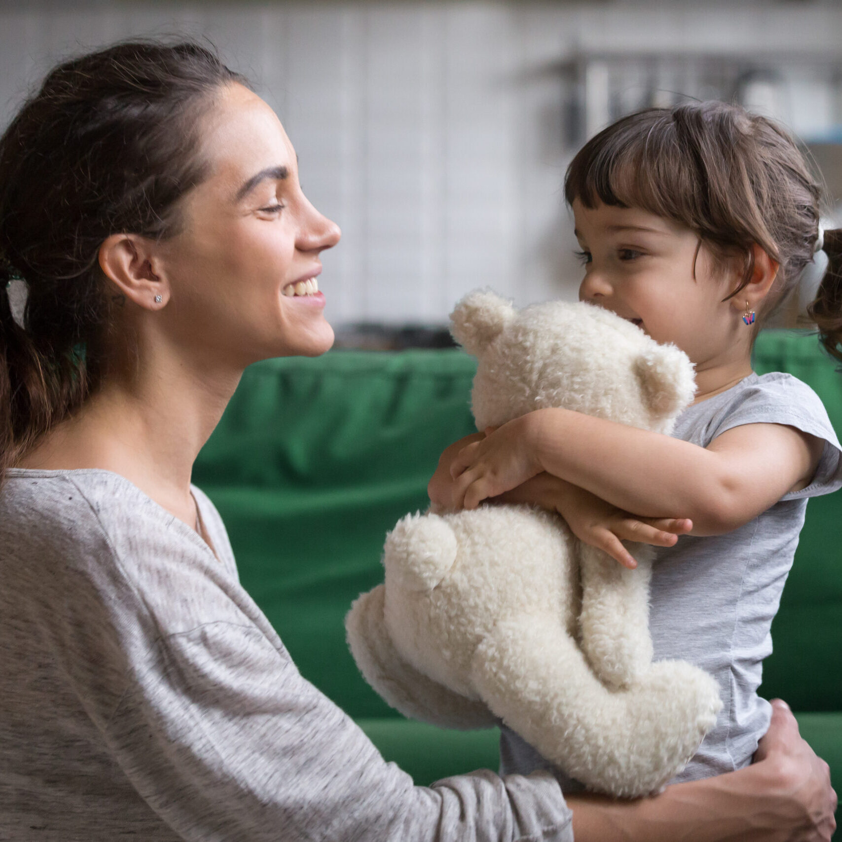 Smiling,Mother,Hugging,Cute,Little,Girl,Holding,Teddy,Bear,Toy